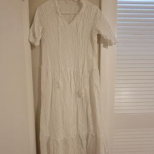 For sale cotton white beach dress. New without tag. Washed once but never worn.